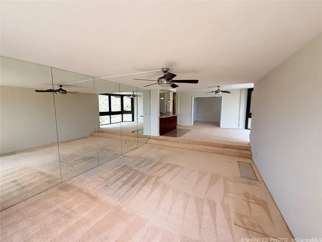 a view of a hallway with a chandelier