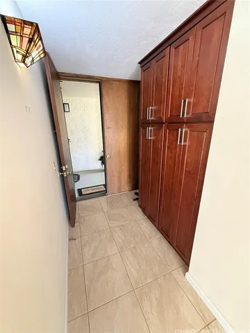 a view of a closet with wooden floor