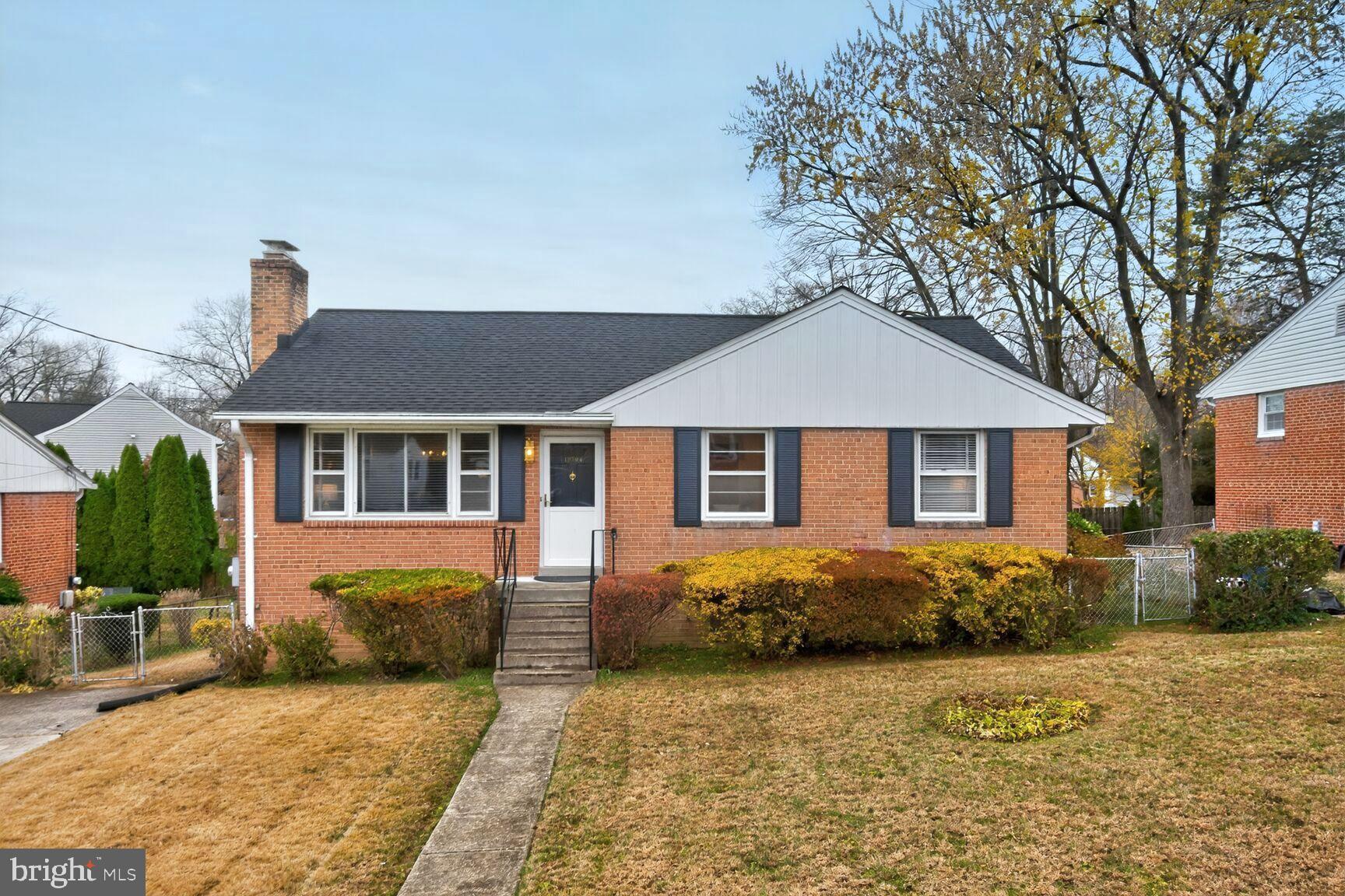10704 Jamaica Drive Silver Spring, MD 20902 - Photo 1 of 26 a front view of a house with a yard