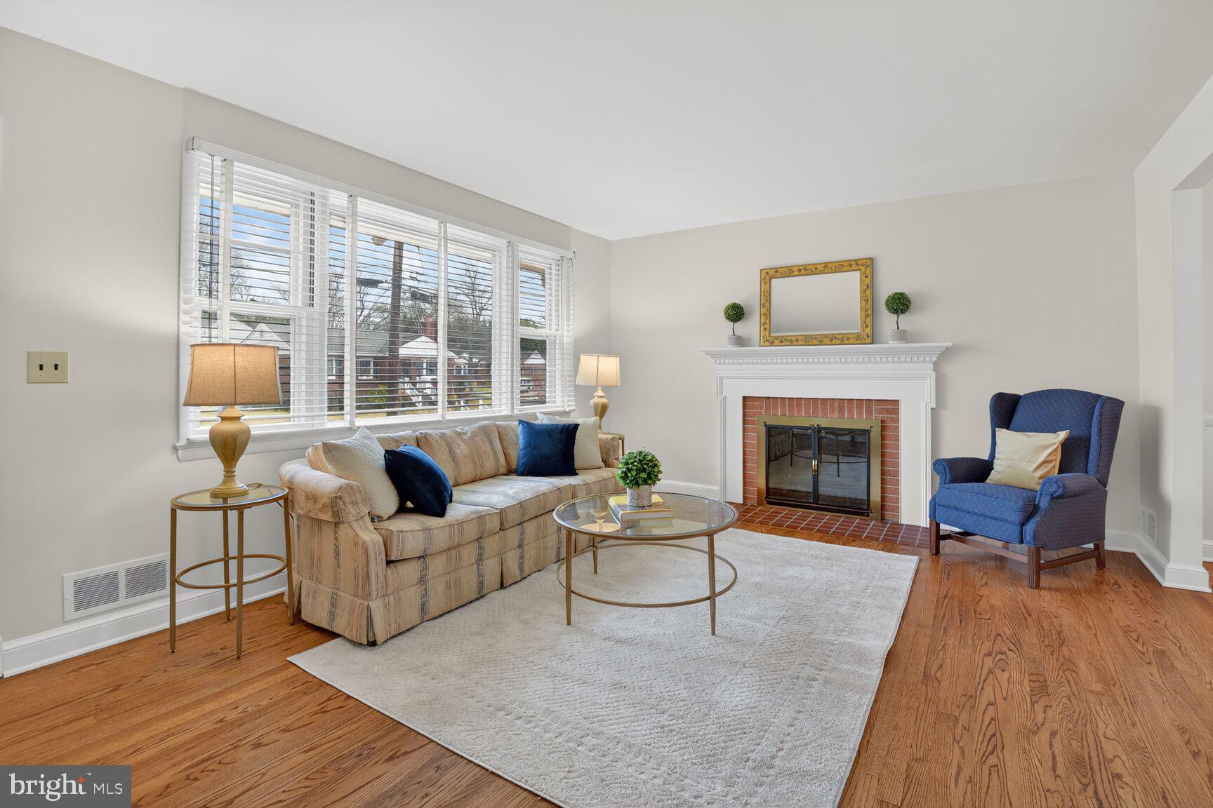 10704 Jamaica Drive Silver Spring, MD 20902 - Photo 2 of 26 a living room with furniture and a fireplace