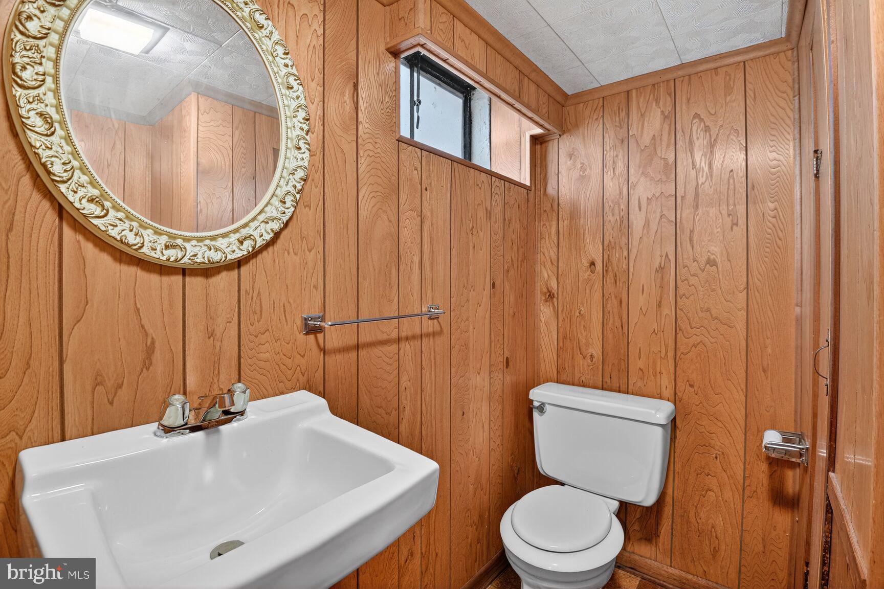 10704 Jamaica Drive Silver Spring, MD 20902 - Photo 23 of 26 a bathroom with a sink a toilet and a mirror