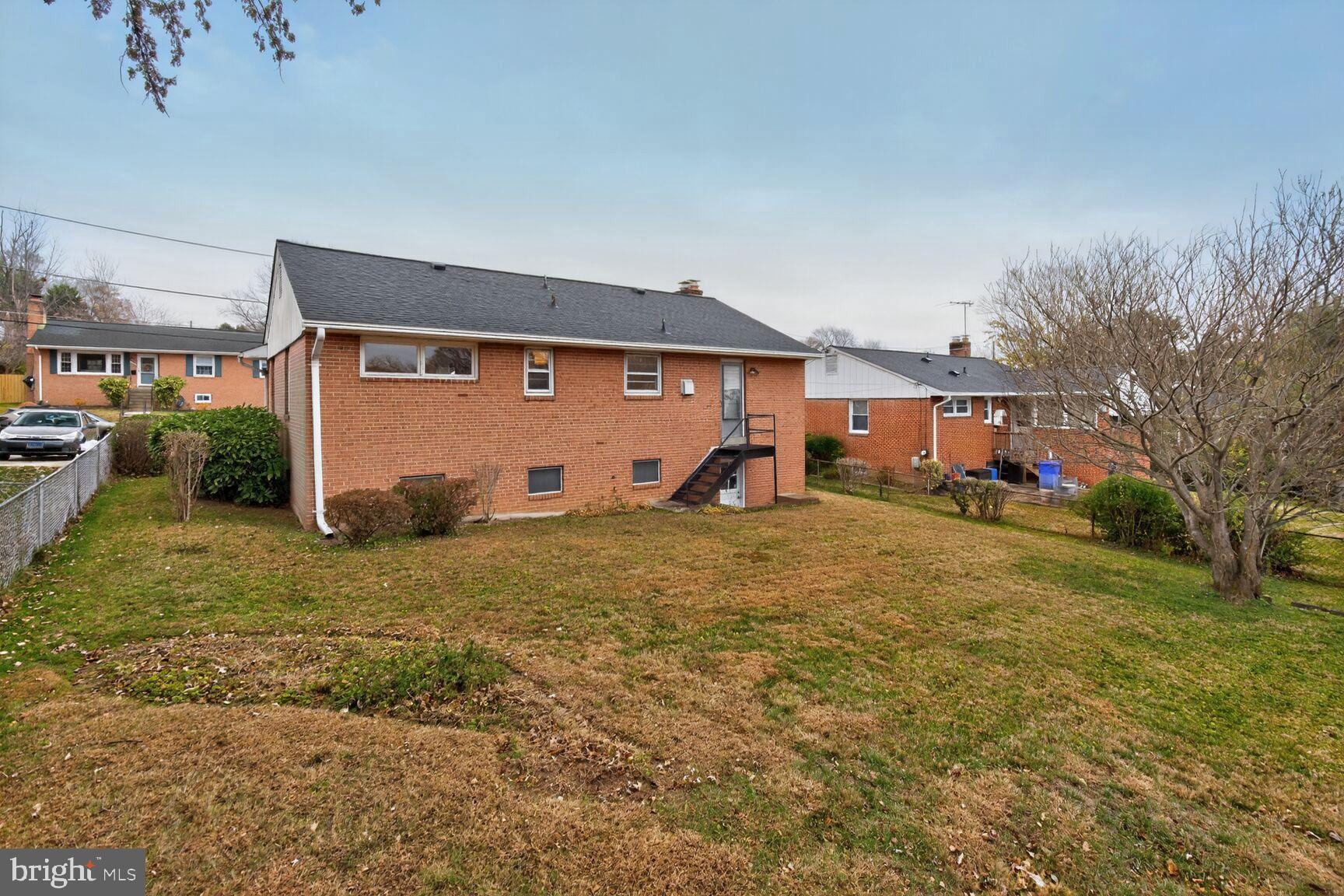 10704 Jamaica Drive Silver Spring, MD 20902 - Photo 25 of 26 a front view of a house with garden