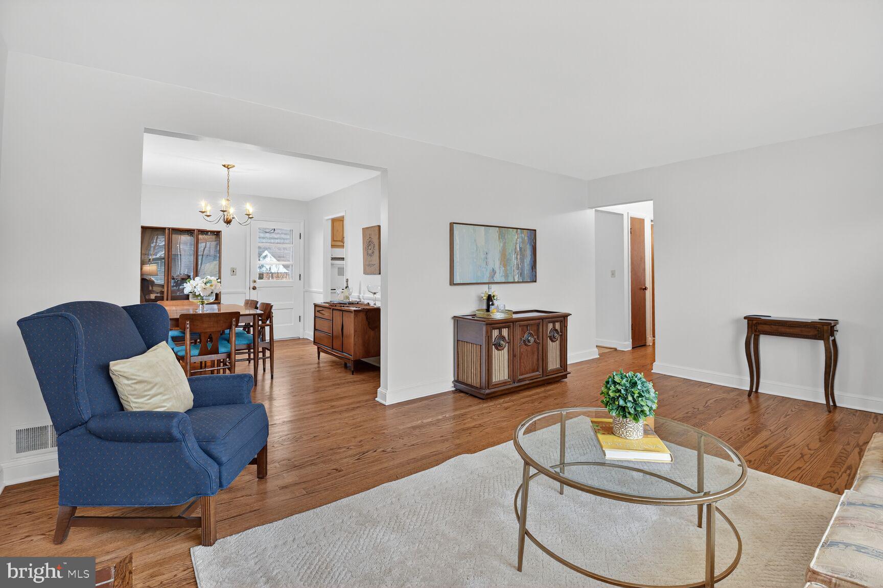 10704 Jamaica Drive Silver Spring, MD 20902 - Photo 3 of 26 a living room with furniture and a wooden floor