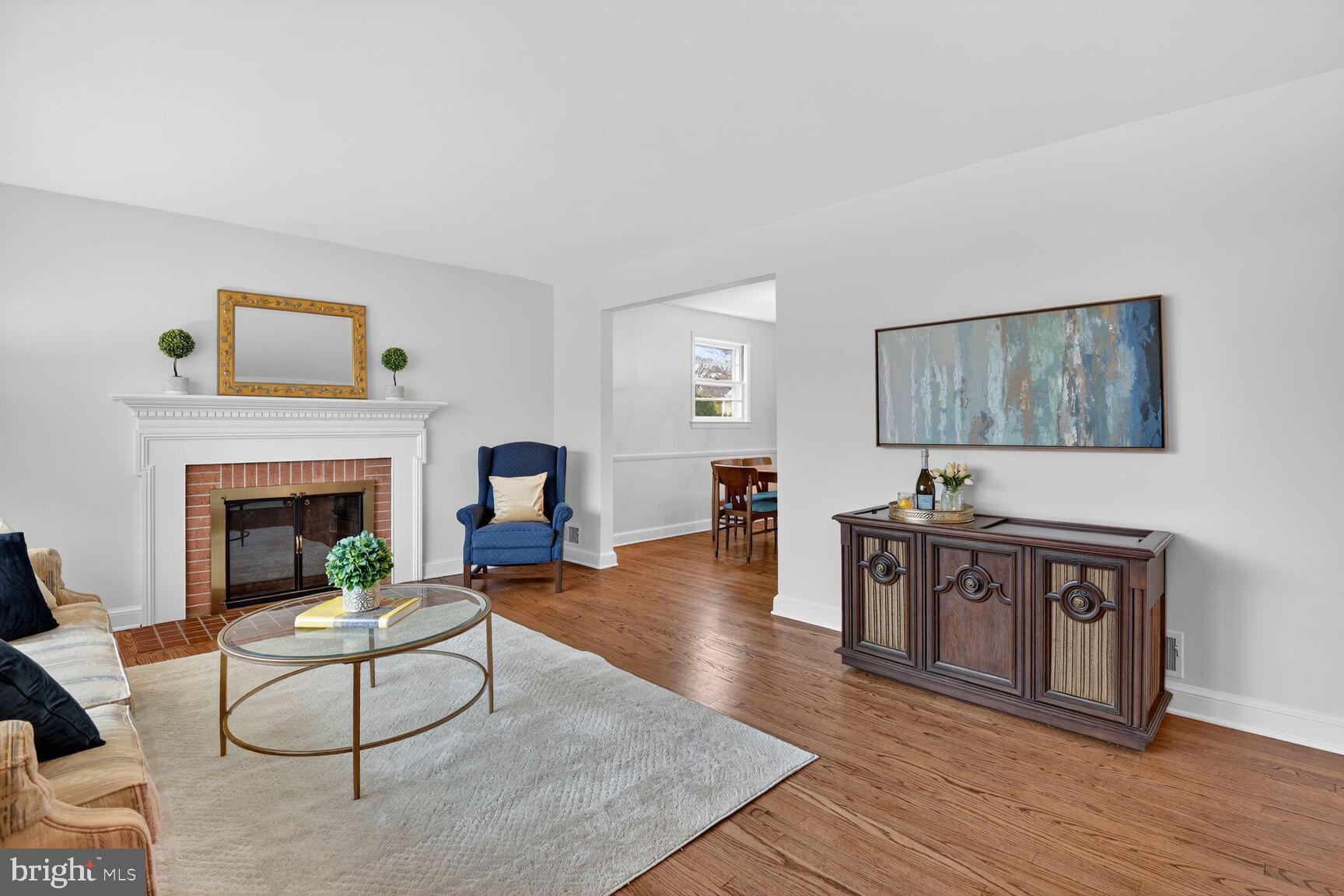 10704 Jamaica Drive Silver Spring, MD 20902 - Photo 4 of 26 a living room with furniture and a fireplace