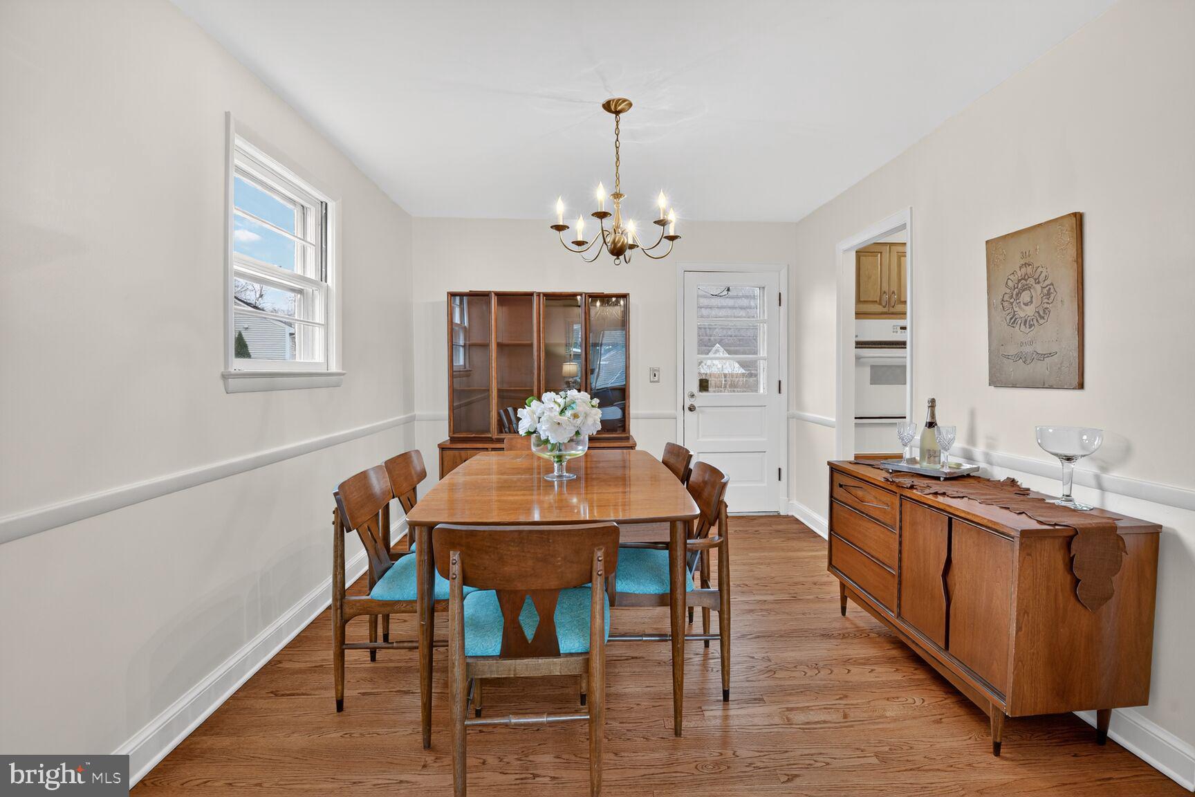 10704 Jamaica Drive Silver Spring, MD 20902 - Photo 7 of 26 a view of a a dining room with furniture window and wooden floor