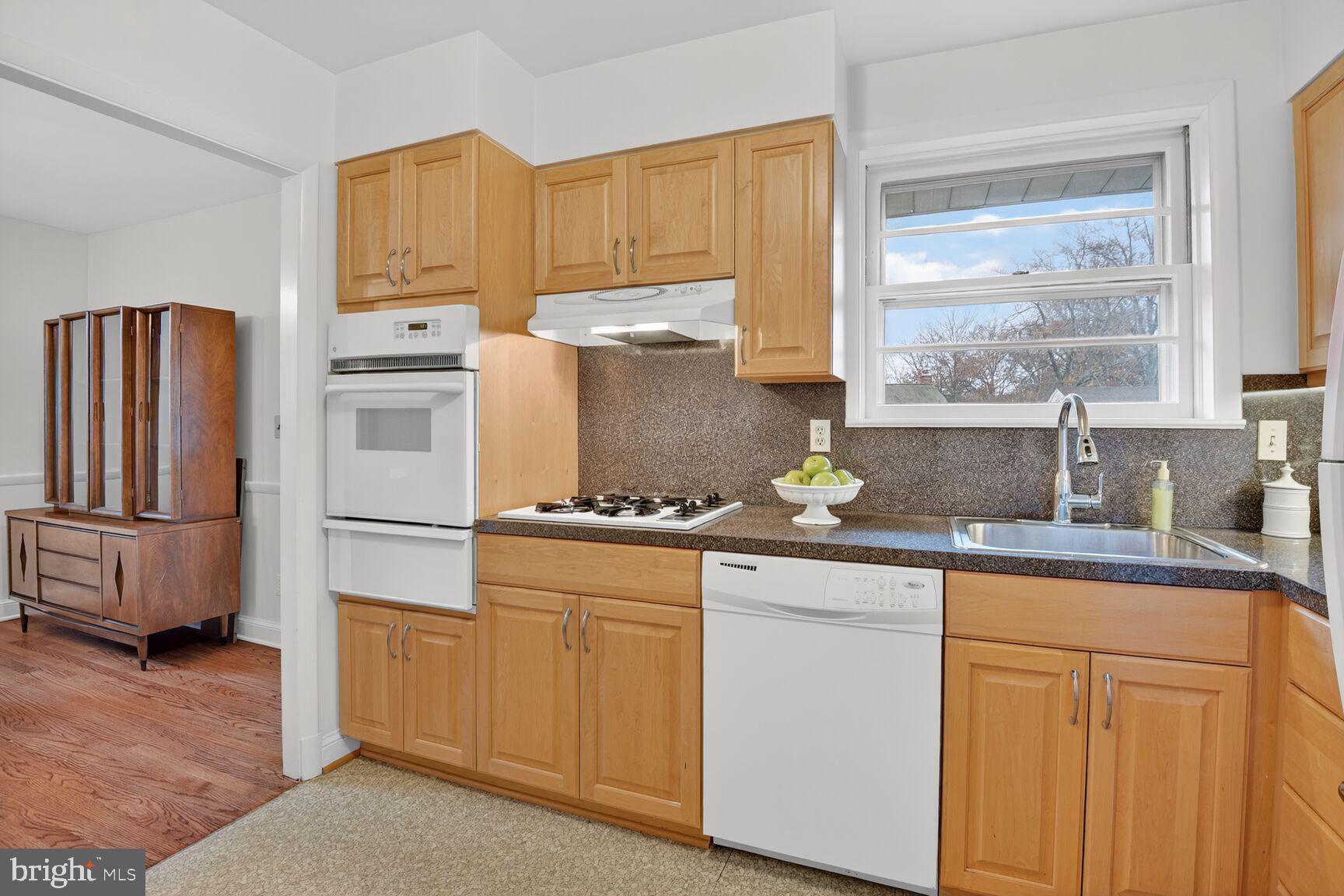 10704 Jamaica Drive Silver Spring, MD 20902 - Photo 8 of 26 a kitchen with appliances a sink and cabinets