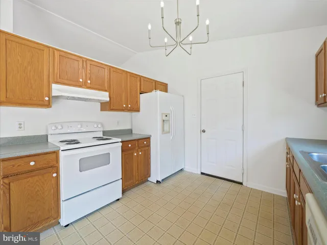 a view of a kitchen with microwave and cabinets