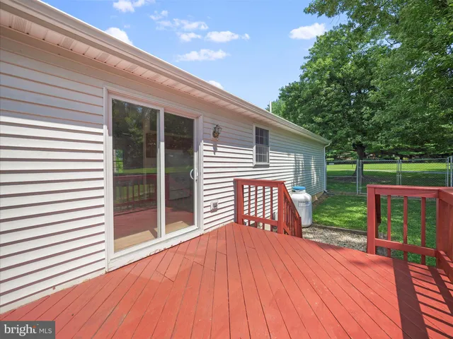 a view of a house with a yard porch and sitting area