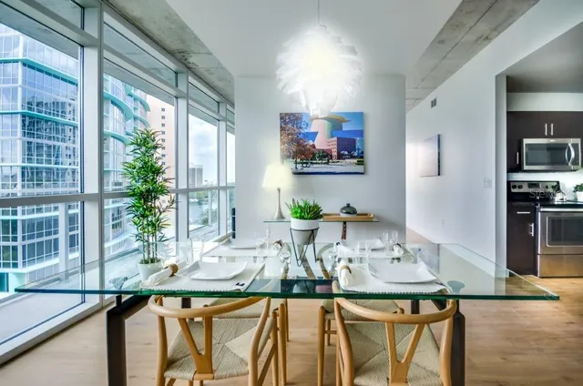 a view of a dining room with furniture window and outside view
