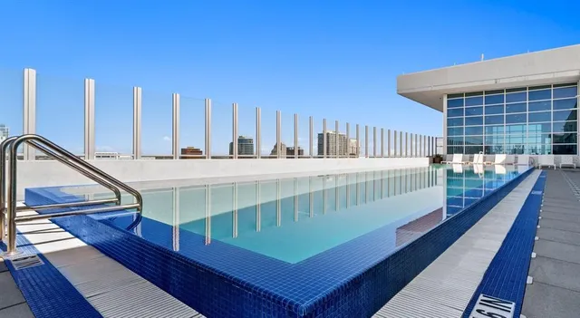 a view of a balcony with wooden floor