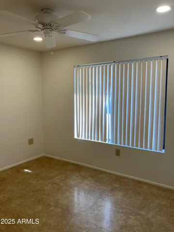 a bathroom with a bathtub shower sink vanity and toilet
