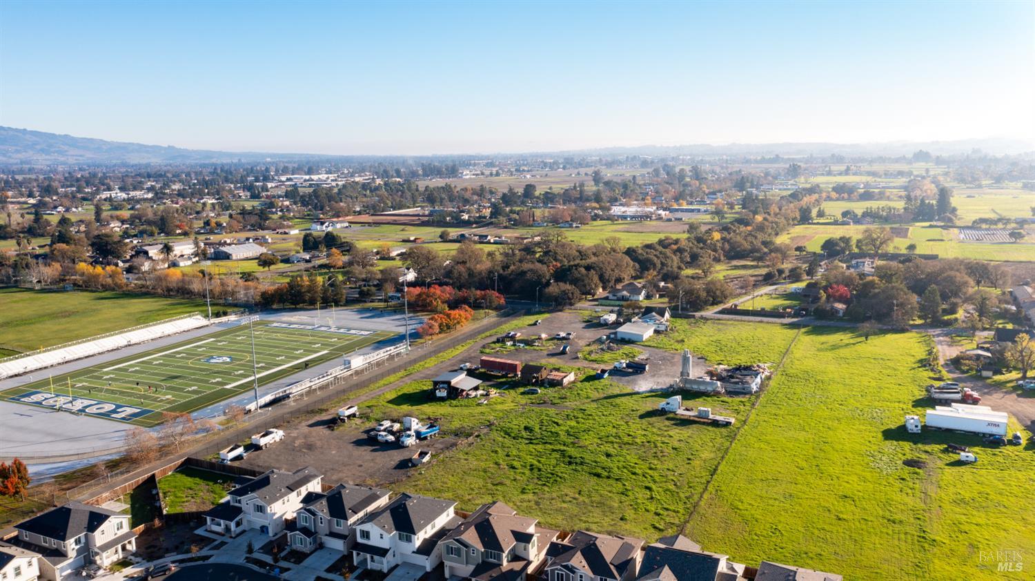 671 Bellevue Avenue Santa Rosa, CA 95407 - Photo 6 of 9 an aerial view of a city with lots of residential buildings ocean and mountain view in back