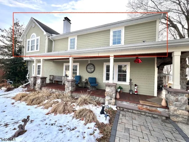 a view of a house with outdoor seating