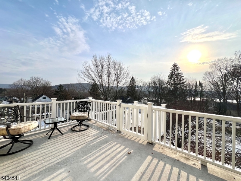 24 Sycamore Street, Unit 1 Sussex, NJ 07461 - Photo 27 of 30 a view of balcony with wooden floor and outdoor seating
