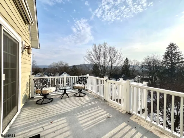 a view of a balcony with furniture