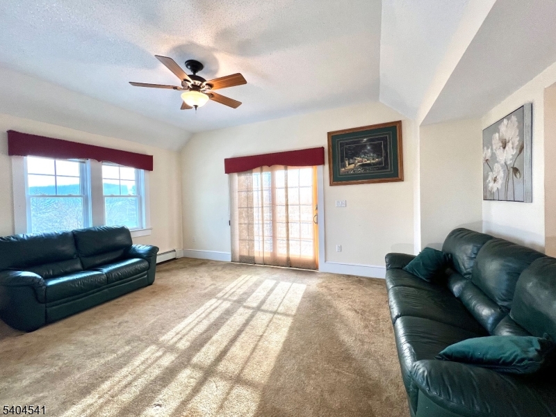 24 Sycamore Street, Unit 1 Sussex, NJ 07461 - Photo 10 of 30 a living room with furniture and a window