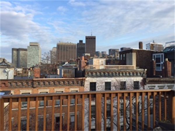 37 Grove Street, Unit 5 Boston, MA 02114 - Photo 16 of 17 a view of city with tall buildings