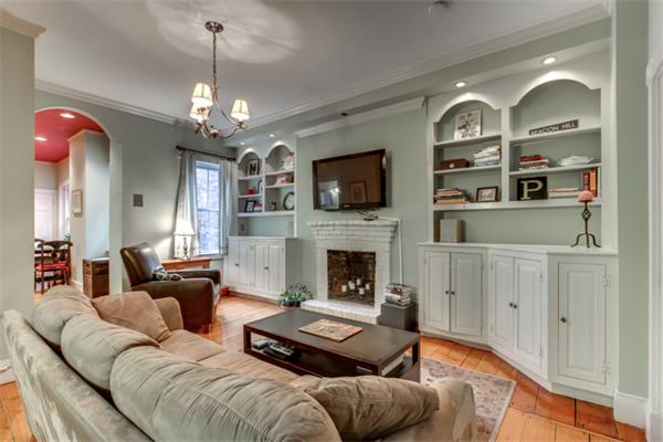 37 Grove Street, Unit 5 Boston, MA 02114 - Photo 3 of 17 a living room with furniture a fireplace and a flat screen tv