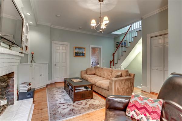 37 Grove Street, Unit 5 Boston, MA 02114 - Photo 4 of 17 a living room with furniture and a chandelier