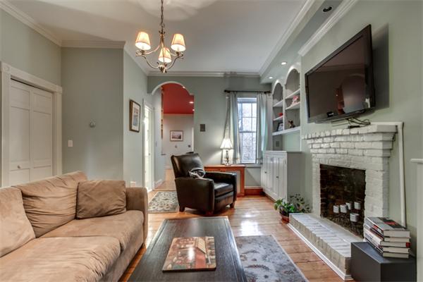 37 Grove Street, Unit 5 Boston, MA 02114 - Photo 5 of 17 a living room with furniture a flat screen tv and a fireplace