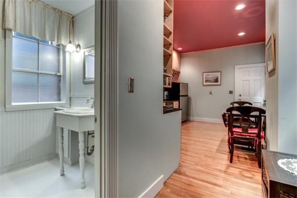 37 Grove Street, Unit 5 Boston, MA 02114 - Photo 9 of 17 a view of kitchen with furniture and wooden floor