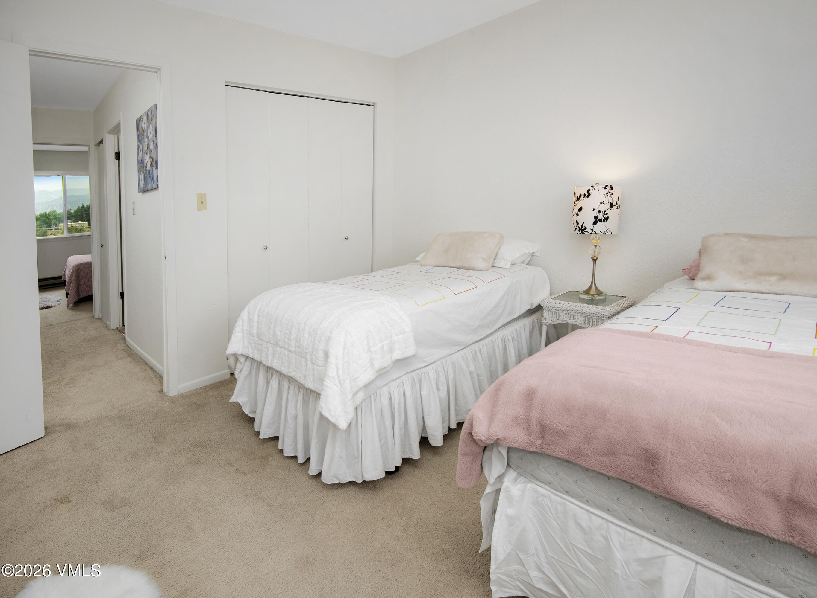85 Chambers Avenue, Unit 10 Eagle, CO 81631 - Photo 19 of 41 a bedroom with two beds and painted walls
