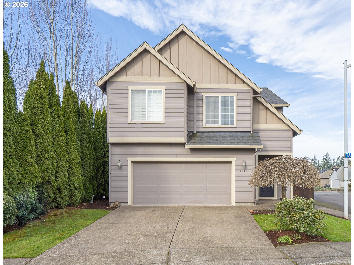 1018 Taurus Loop Northeast Keizer, OR 97303 - Photo 1 of 47 a front view of a house with a garden and garage