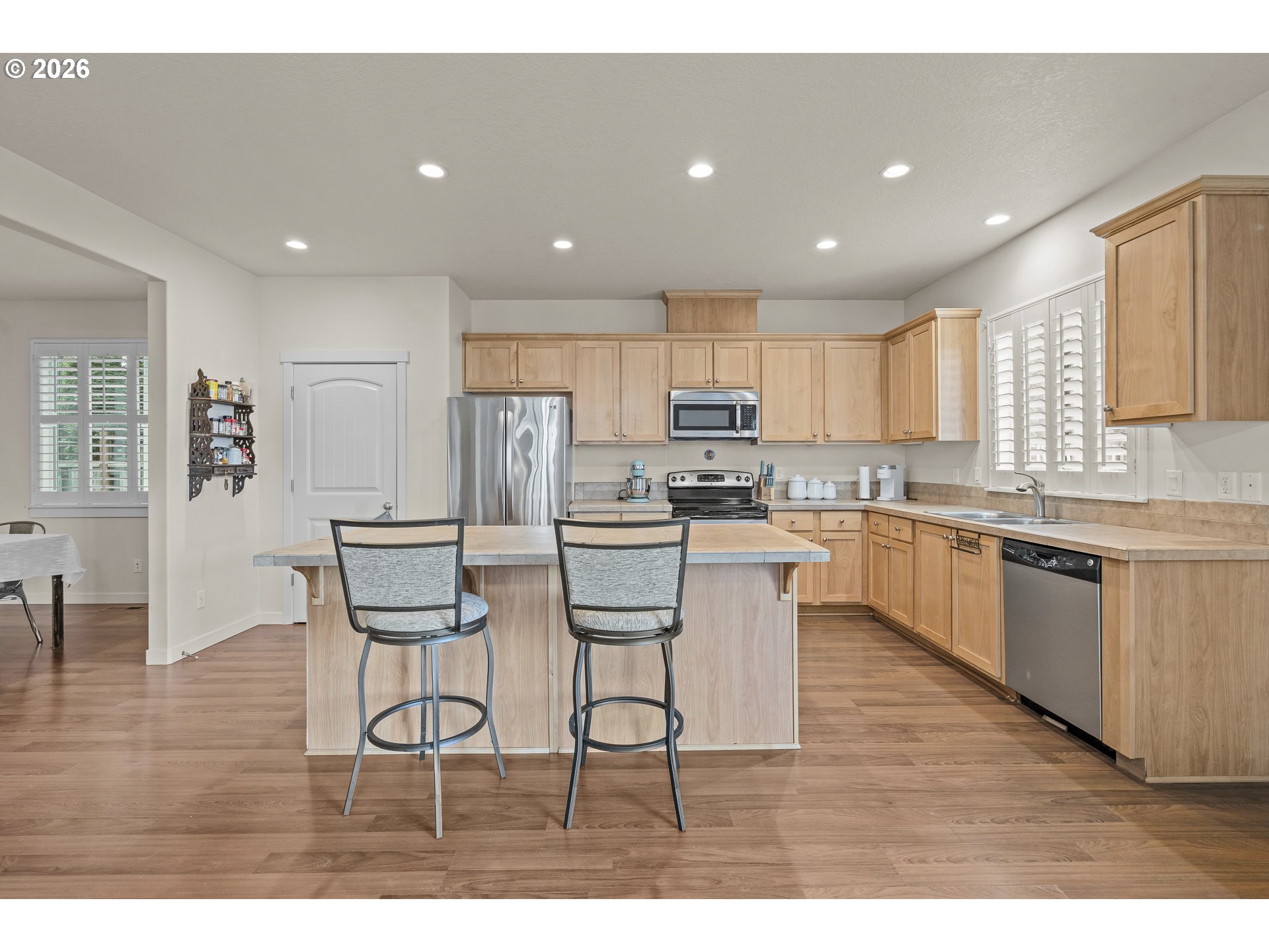 1018 Taurus Loop Northeast Keizer, OR 97303 - Photo 11 of 47 a kitchen with a sink cabinets and wooden floor