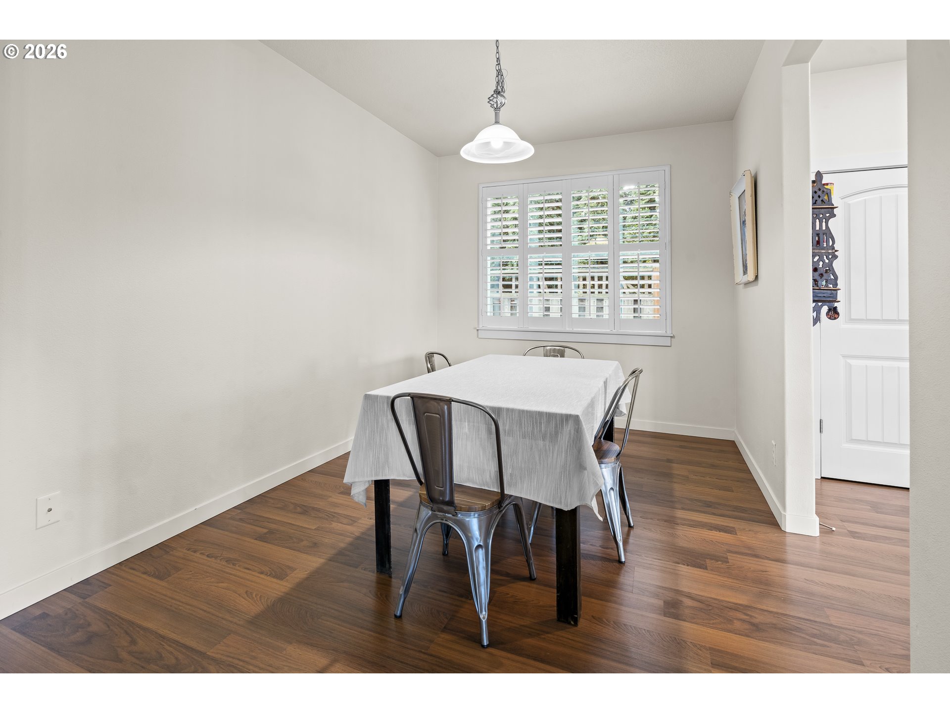 1018 Taurus Loop Northeast Keizer, OR 97303 - Photo 12 of 47 a view of a dining room with furniture and wooden floor