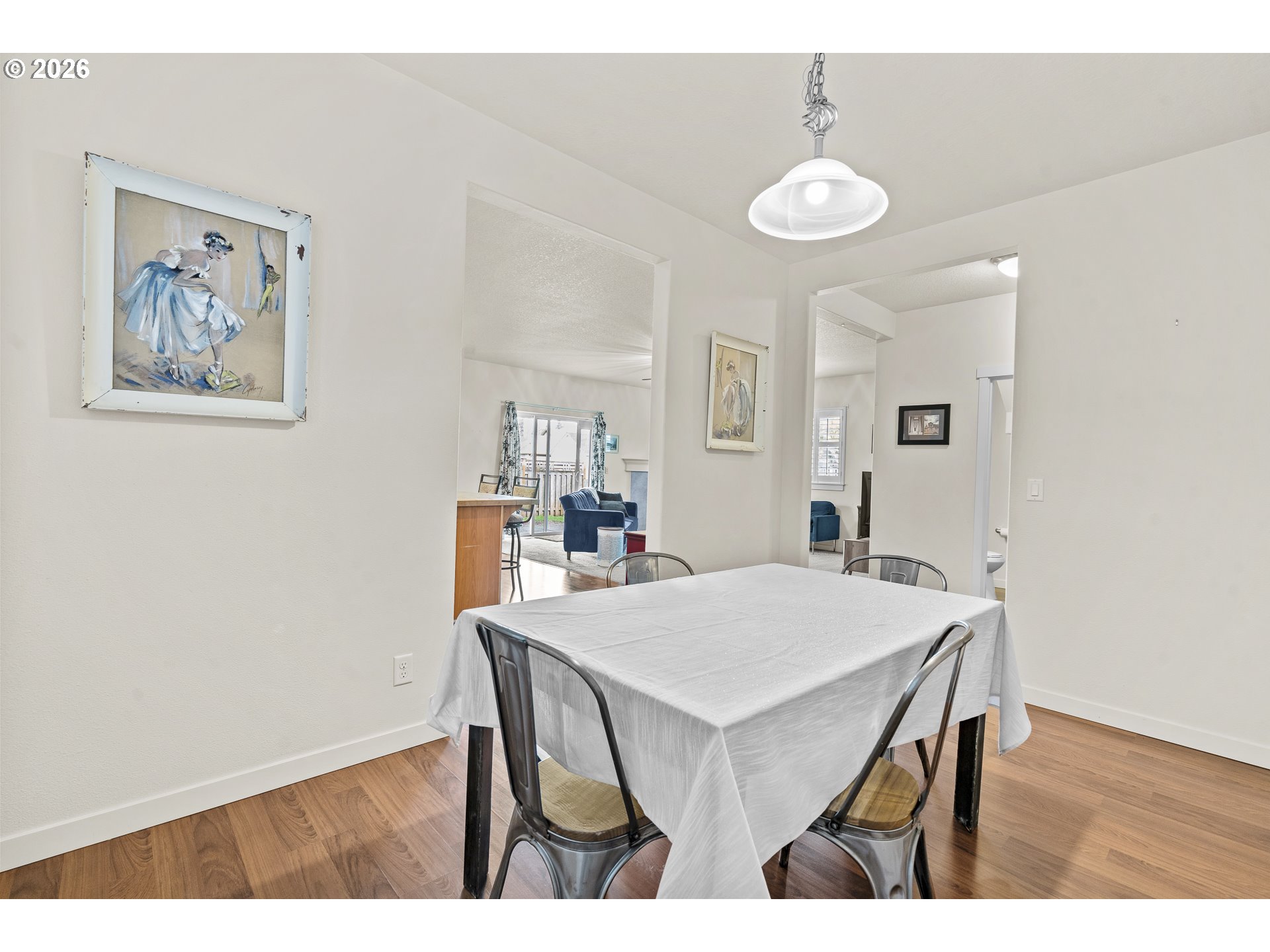 1018 Taurus Loop Northeast Keizer, OR 97303 - Photo 13 of 47 a view of a dining room with furniture and wooden floor