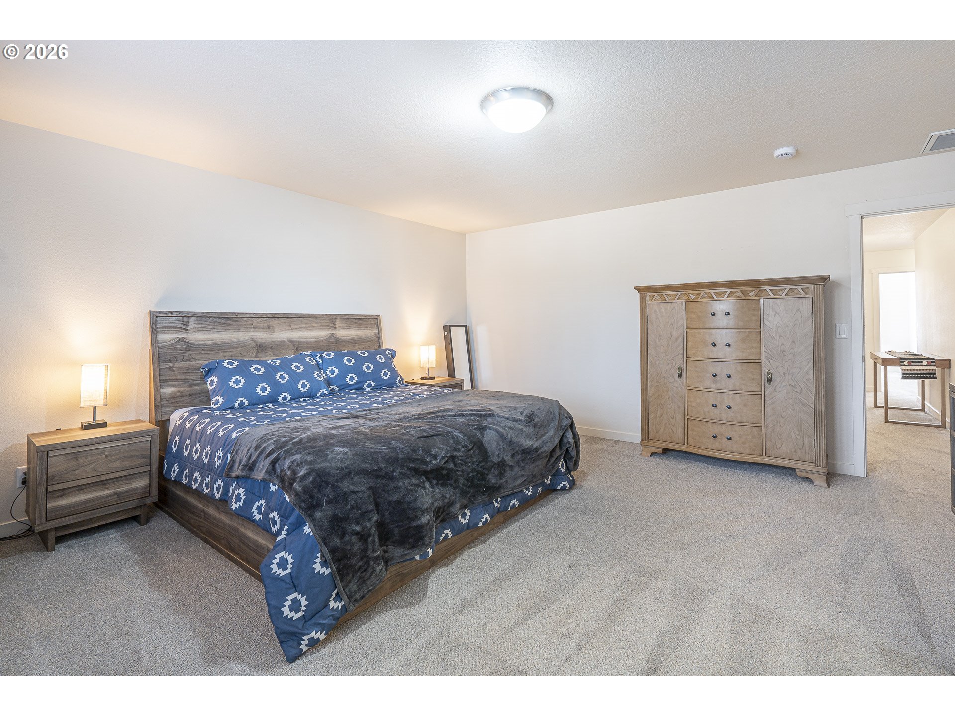 1018 Taurus Loop Northeast Keizer, OR 97303 - Photo 24 of 47 a bedroom with a bed and a night stand