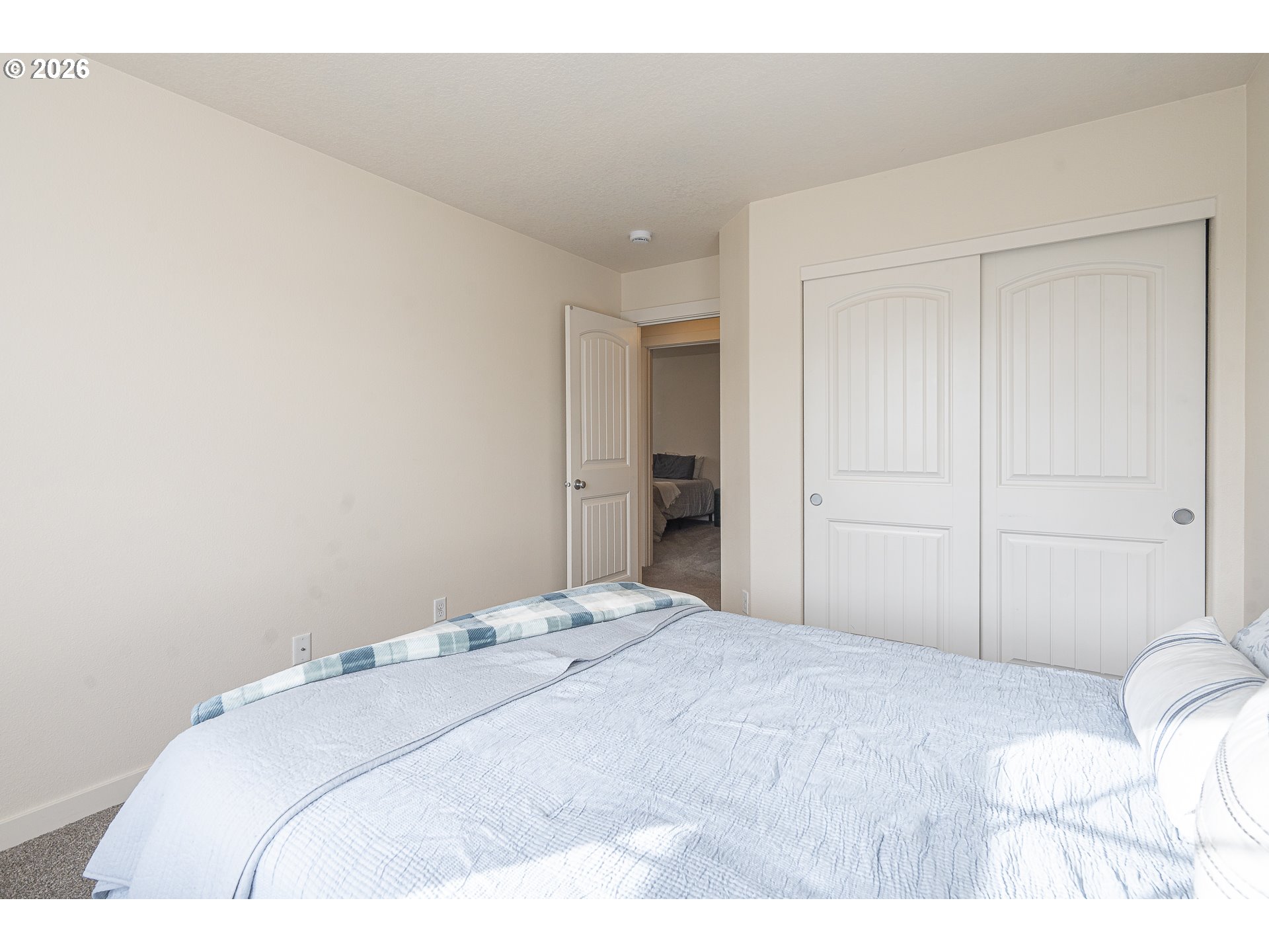 1018 Taurus Loop Northeast Keizer, OR 97303 - Photo 31 of 47 a bedroom with a bed and a mirror