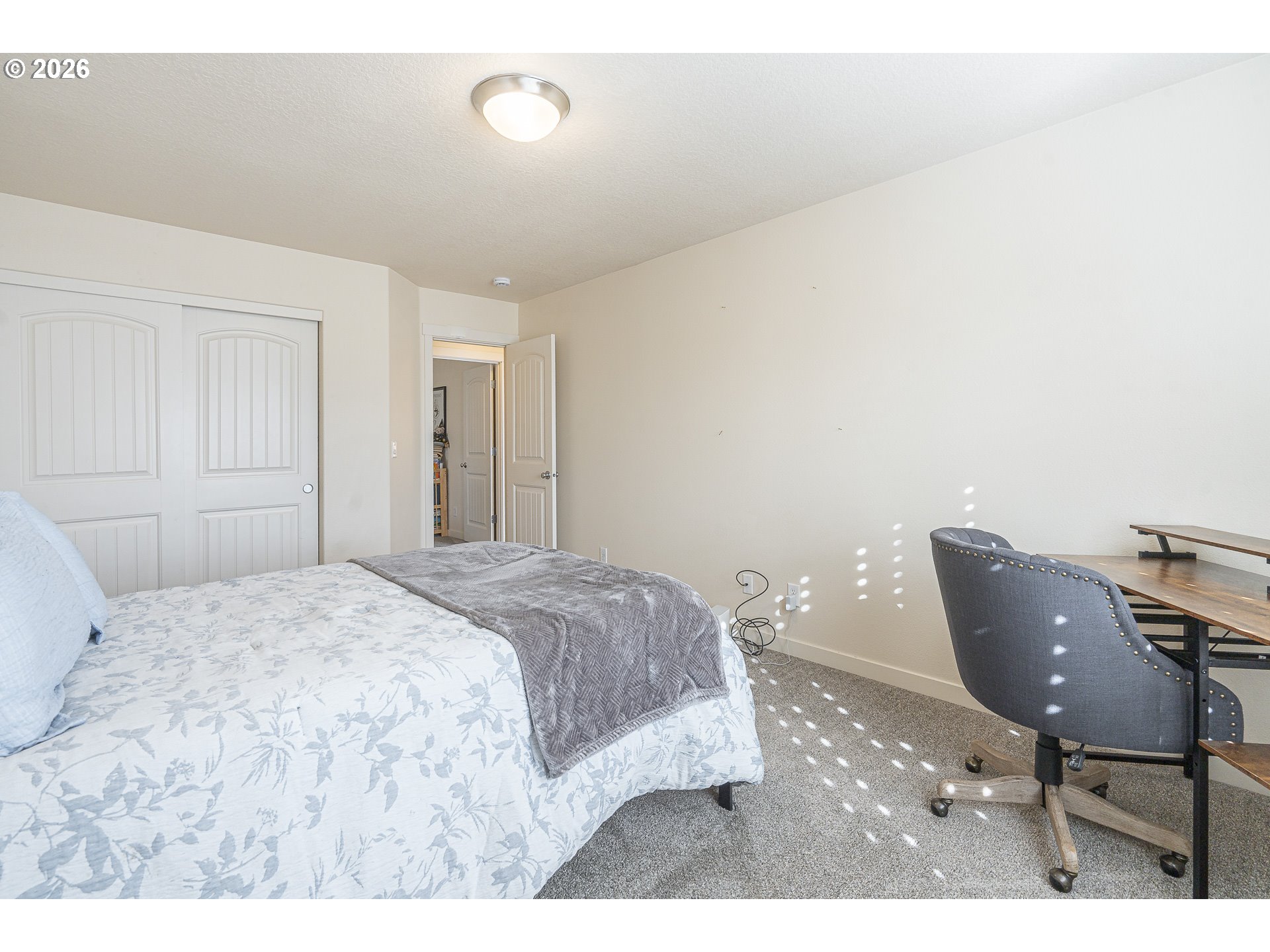 1018 Taurus Loop Northeast Keizer, OR 97303 - Photo 33 of 47 a bedroom with a bed and chair