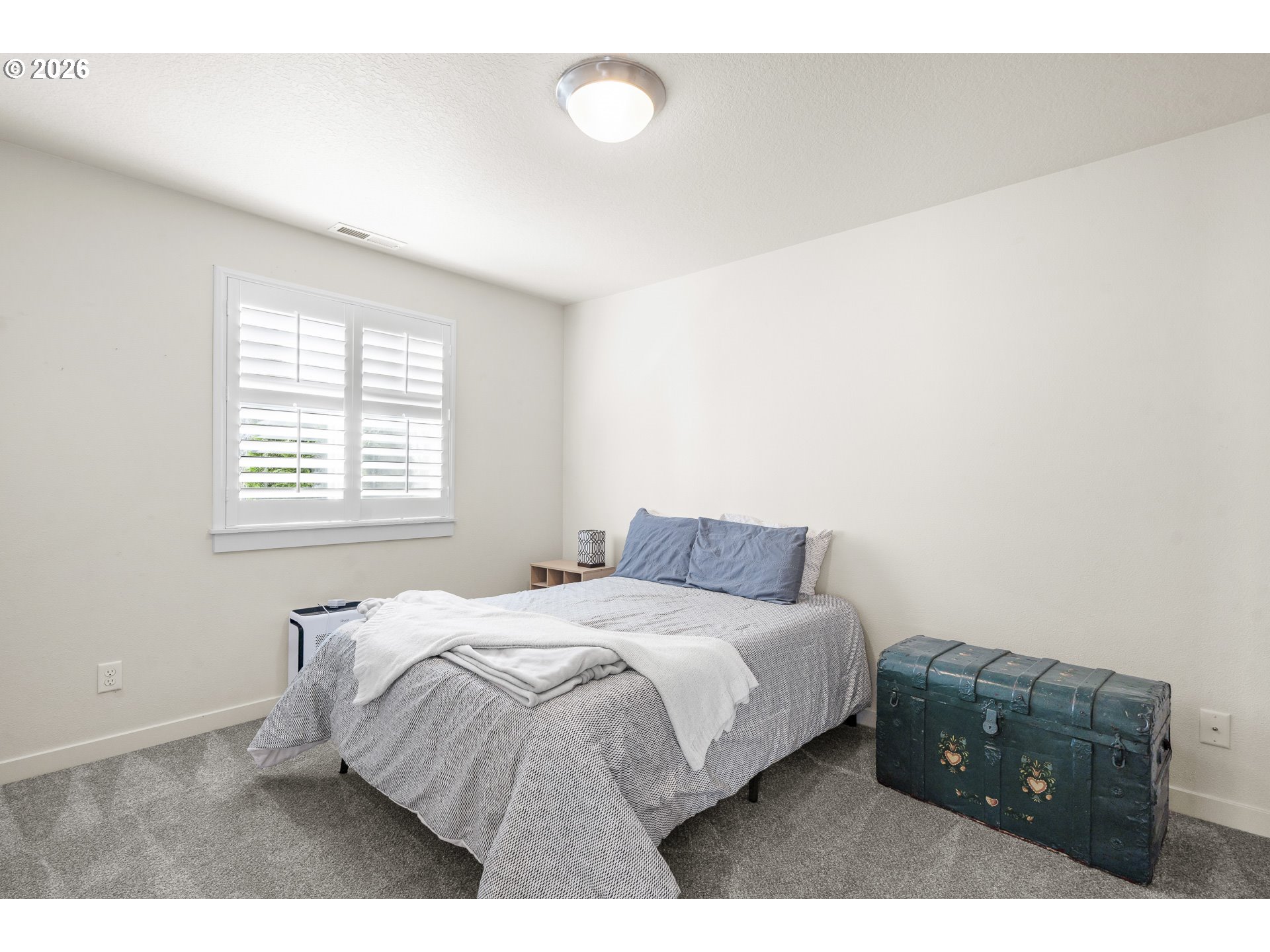 1018 Taurus Loop Northeast Keizer, OR 97303 - Photo 34 of 47 a bedroom with a bed and a night stand