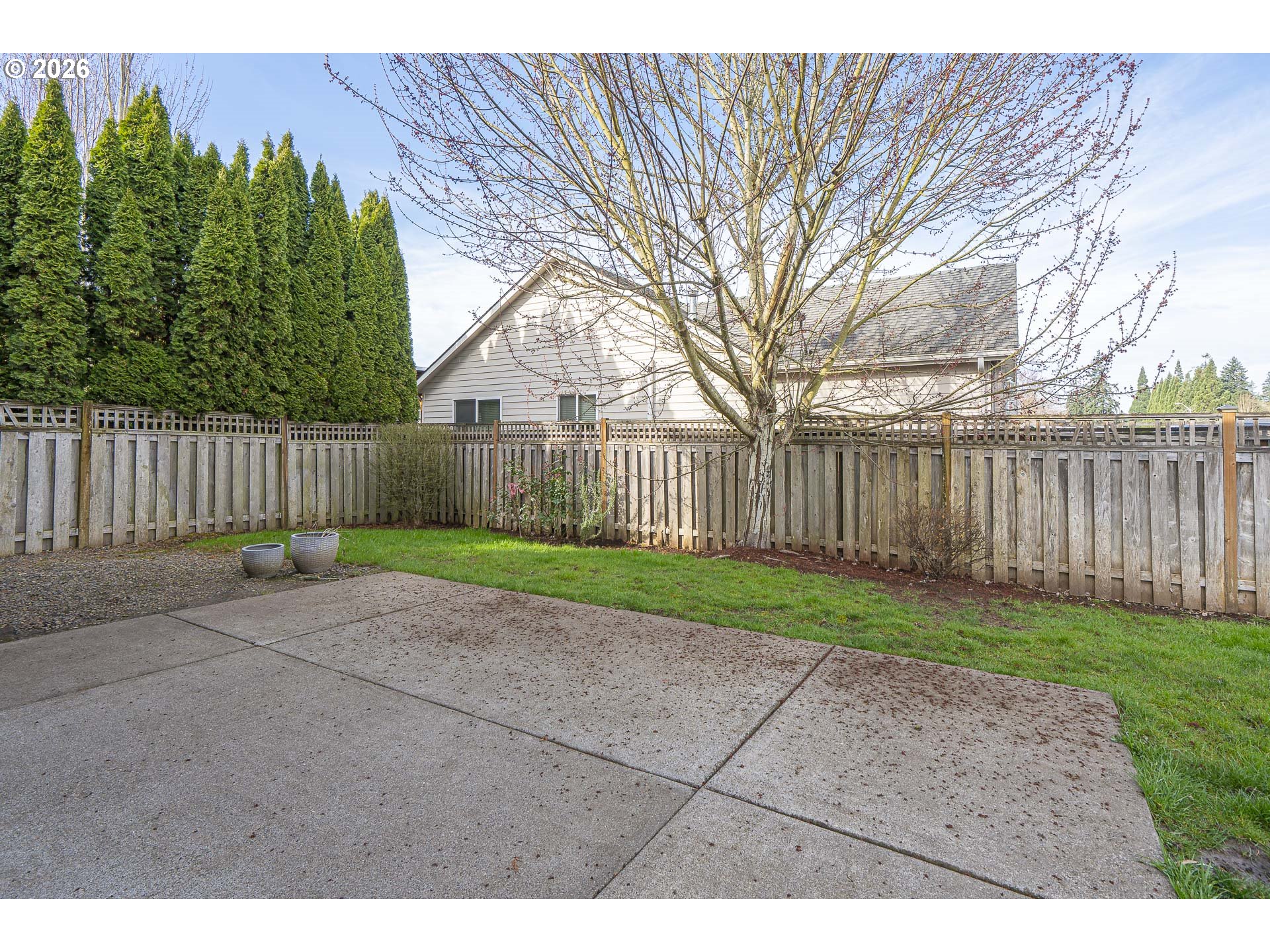1018 Taurus Loop Northeast Keizer, OR 97303 - Photo 36 of 47 a view of a backyard with wooden fence
