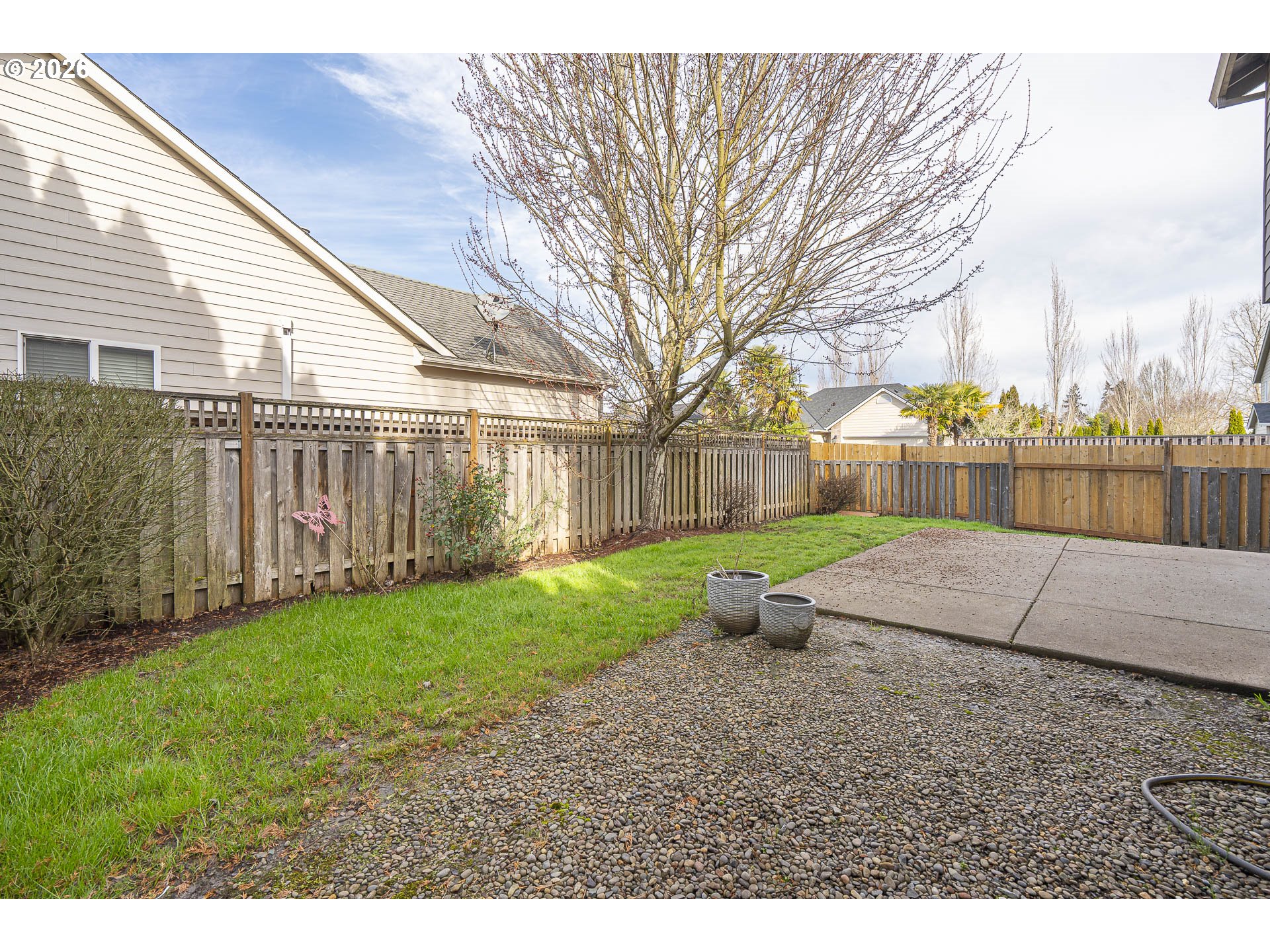 1018 Taurus Loop Northeast Keizer, OR 97303 - Photo 37 of 47 a view of a backyard with large trees