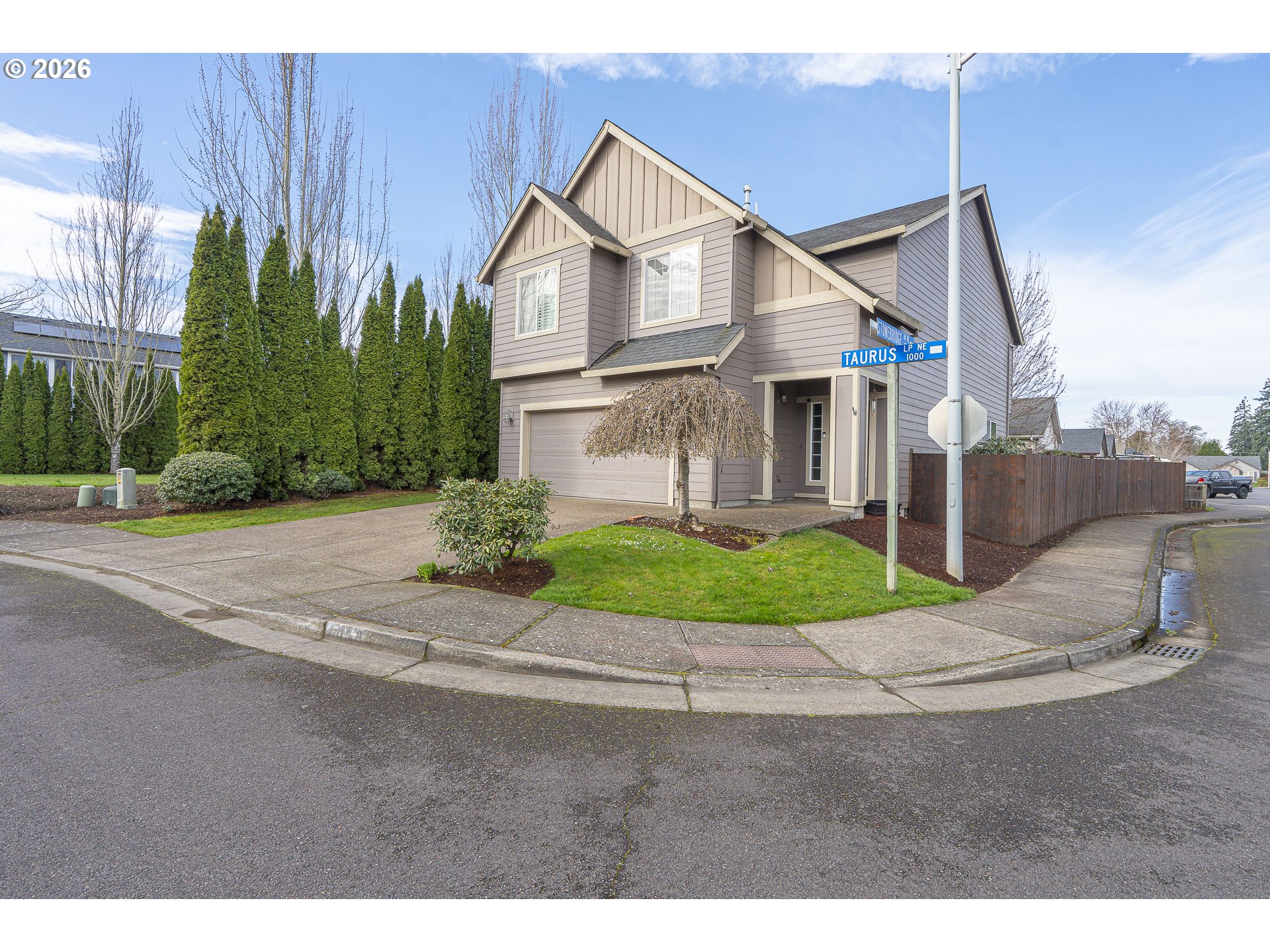 1018 Taurus Loop Northeast Keizer, OR 97303 - Photo 43 of 47 a front view of a house with a garden and garage