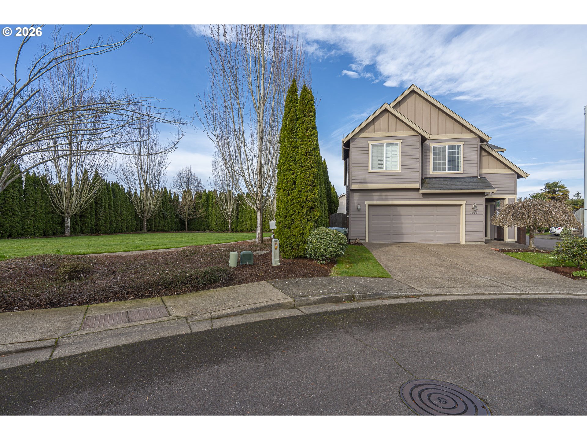 1018 Taurus Loop Northeast Keizer, OR 97303 - Photo 45 of 47 a front view of a house with a yard and garage