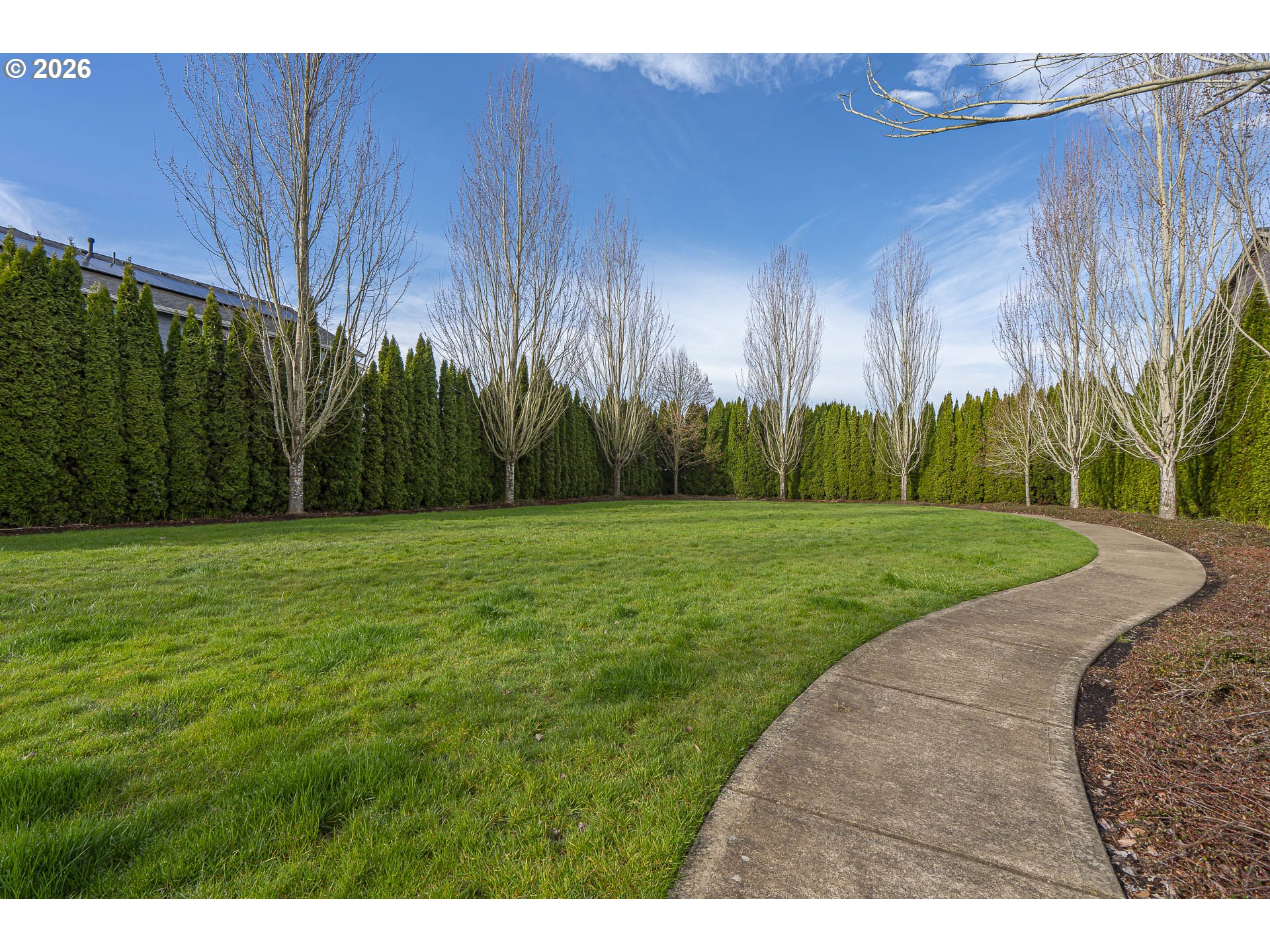 1018 Taurus Loop Northeast Keizer, OR 97303 - Photo 46 of 47 a backyard of a house with palm trees