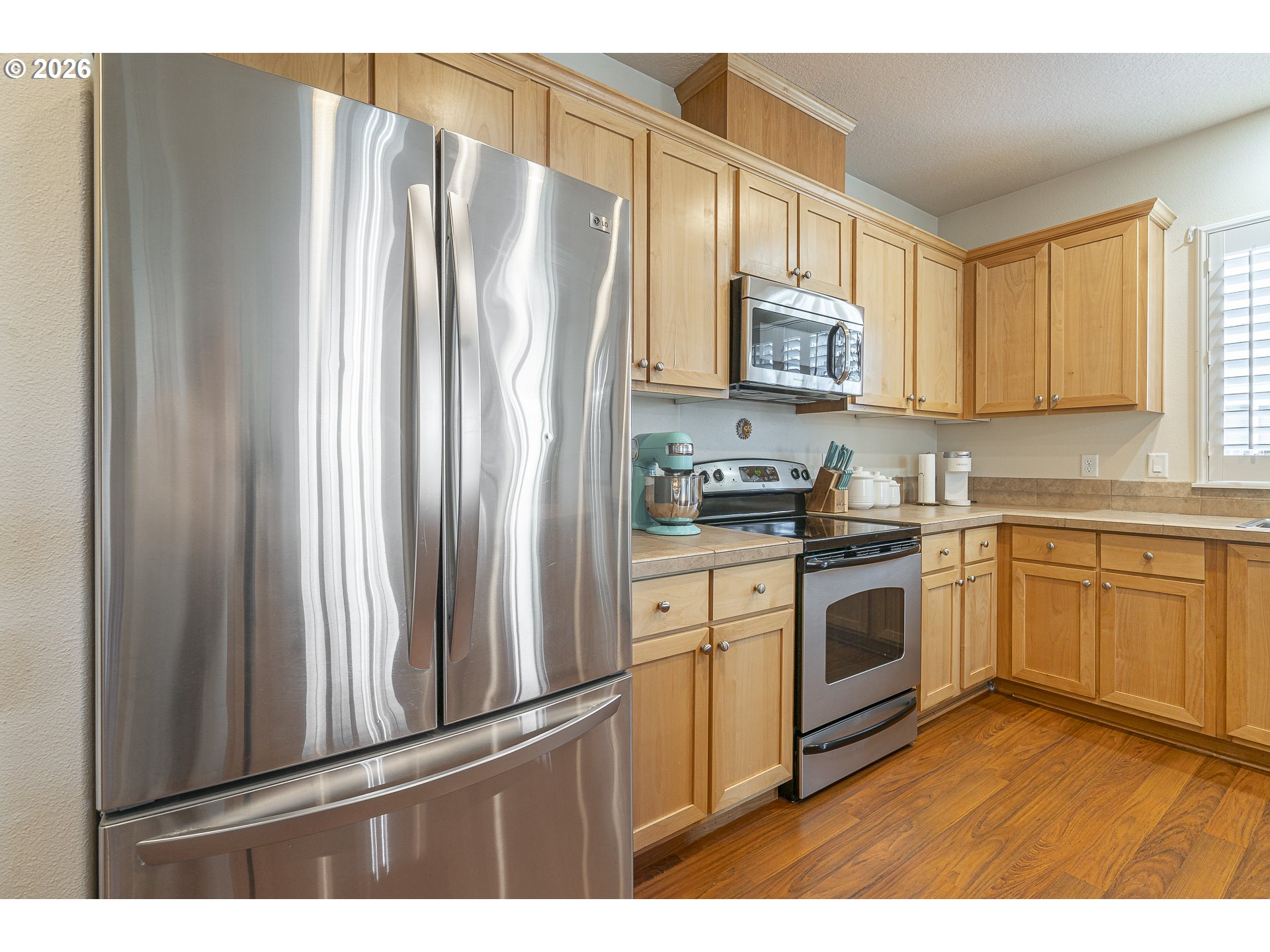 1018 Taurus Loop Northeast Keizer, OR 97303 - Photo 7 of 47 a kitchen with stainless steel appliances granite countertop a refrigerator sink and stove