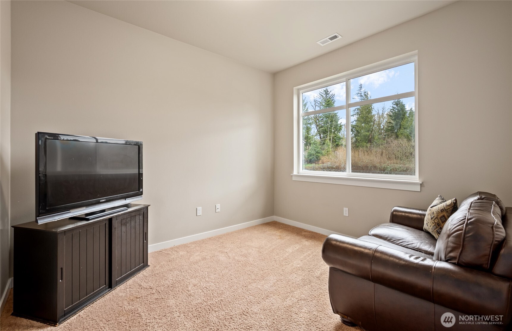 711 10th Street Sultan, WA 98294 - Photo 15 of 30 a living room with furniture and a flat screen tv