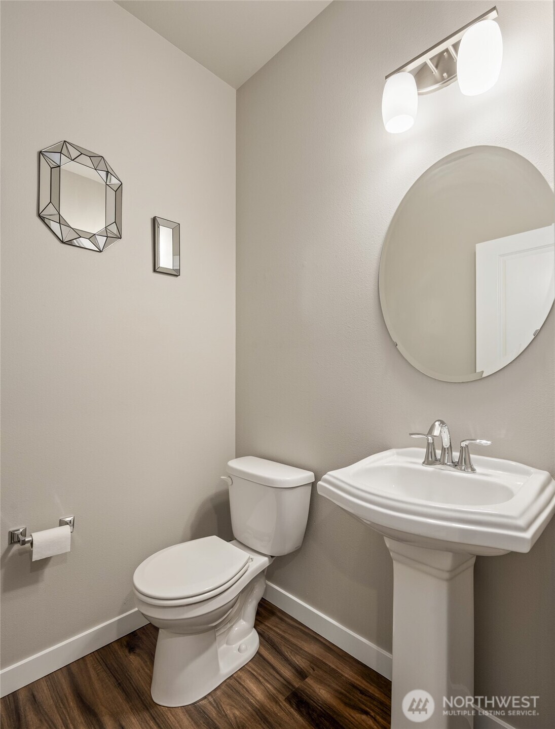 711 10th Street Sultan, WA 98294 - Photo 16 of 30 a bathroom with a sink mirror and toilet