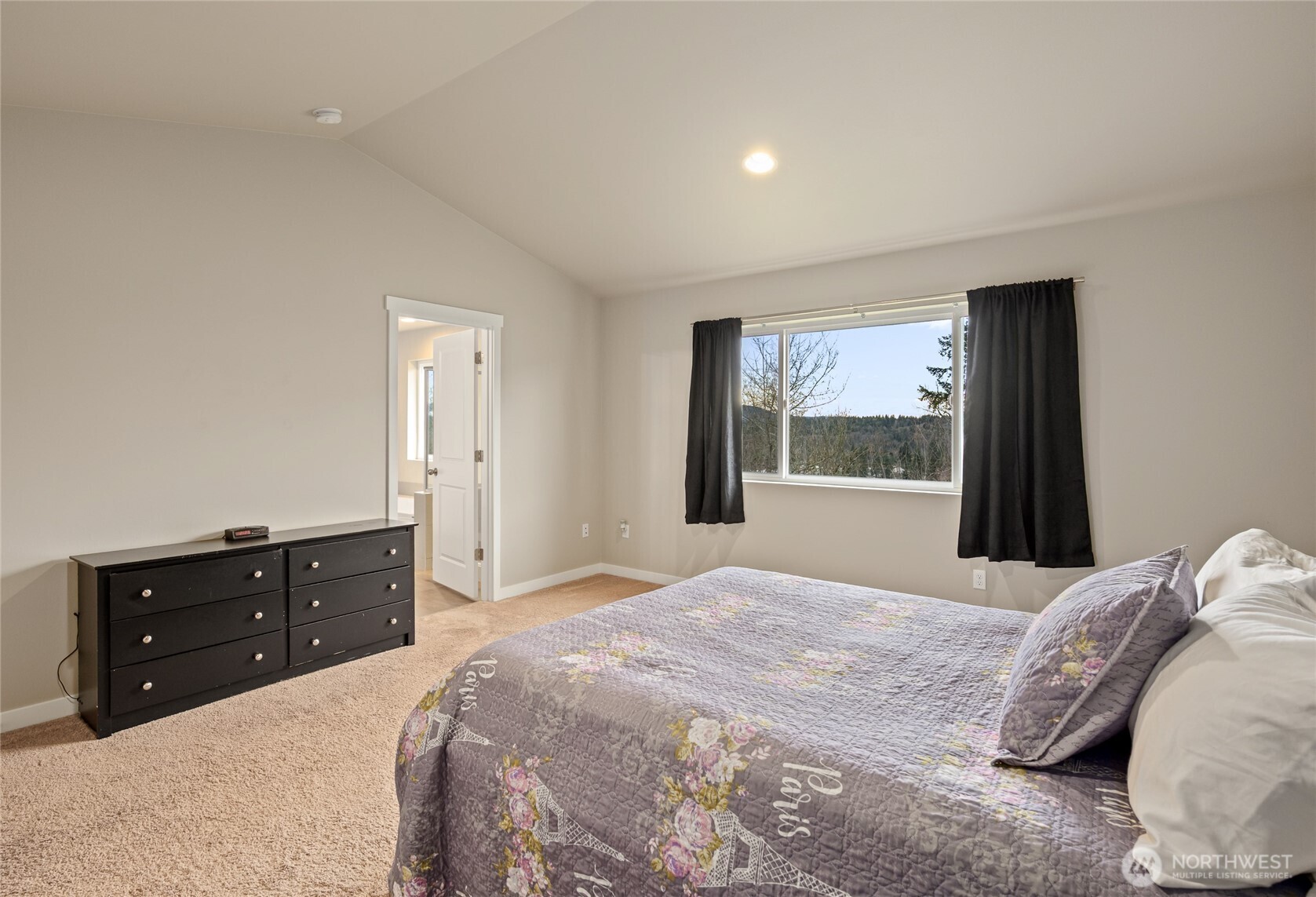 711 10th Street Sultan, WA 98294 - Photo 18 of 30 a bedroom with a bed and a dresser