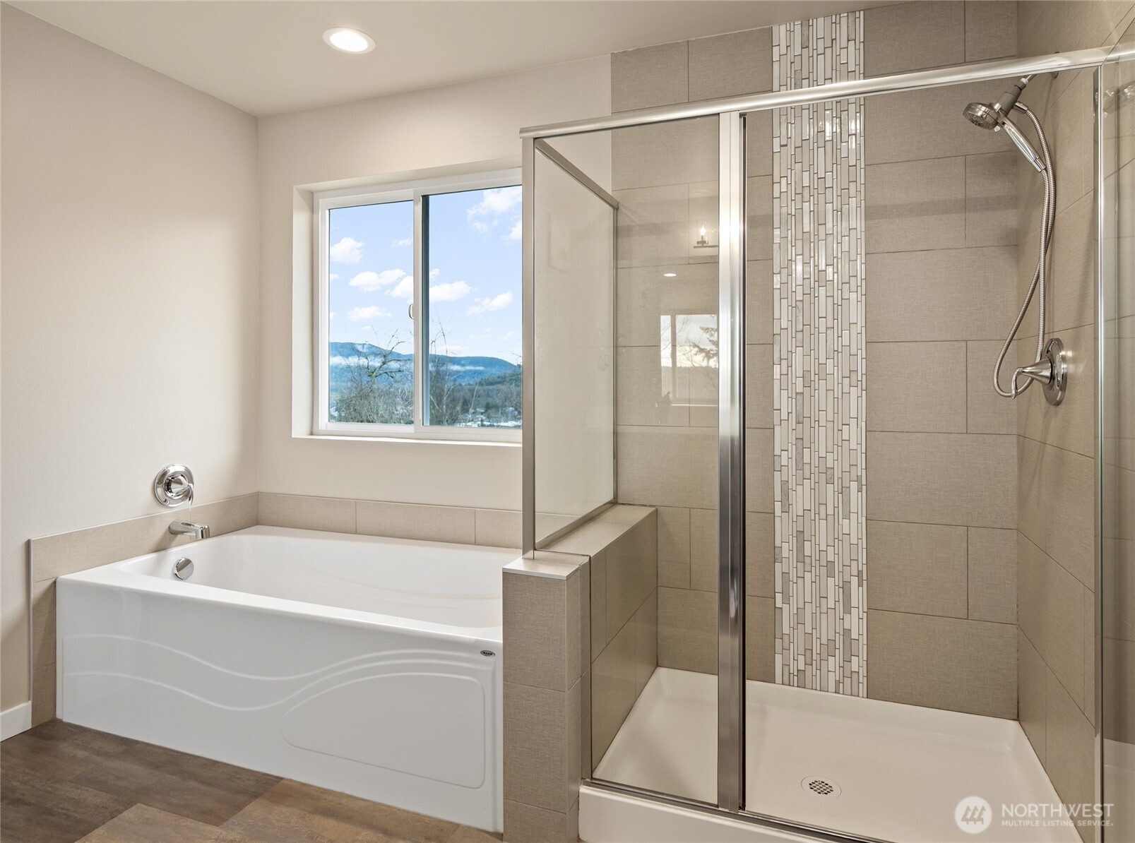 711 10th Street Sultan, WA 98294 - Photo 19 of 30 a white bath tub sitting next to a shower
