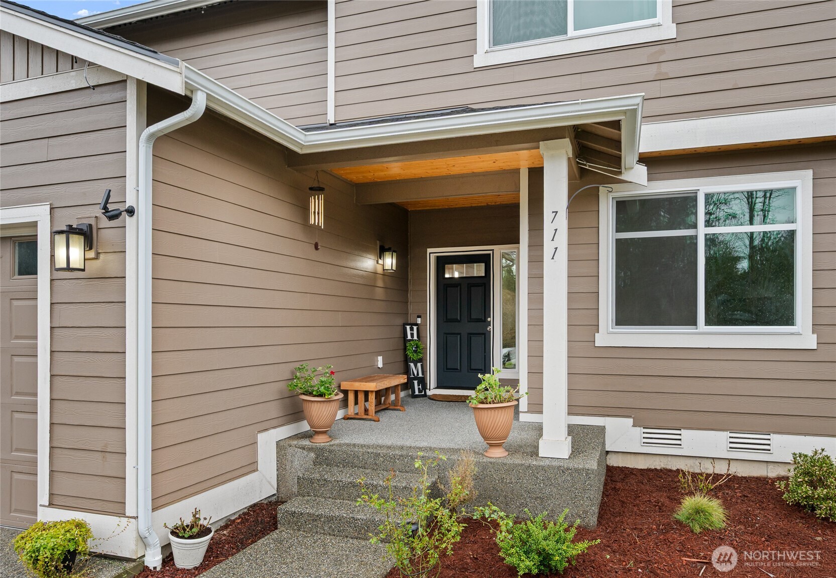 711 10th Street Sultan, WA 98294 - Photo 2 of 30 a view of a porch with a bench