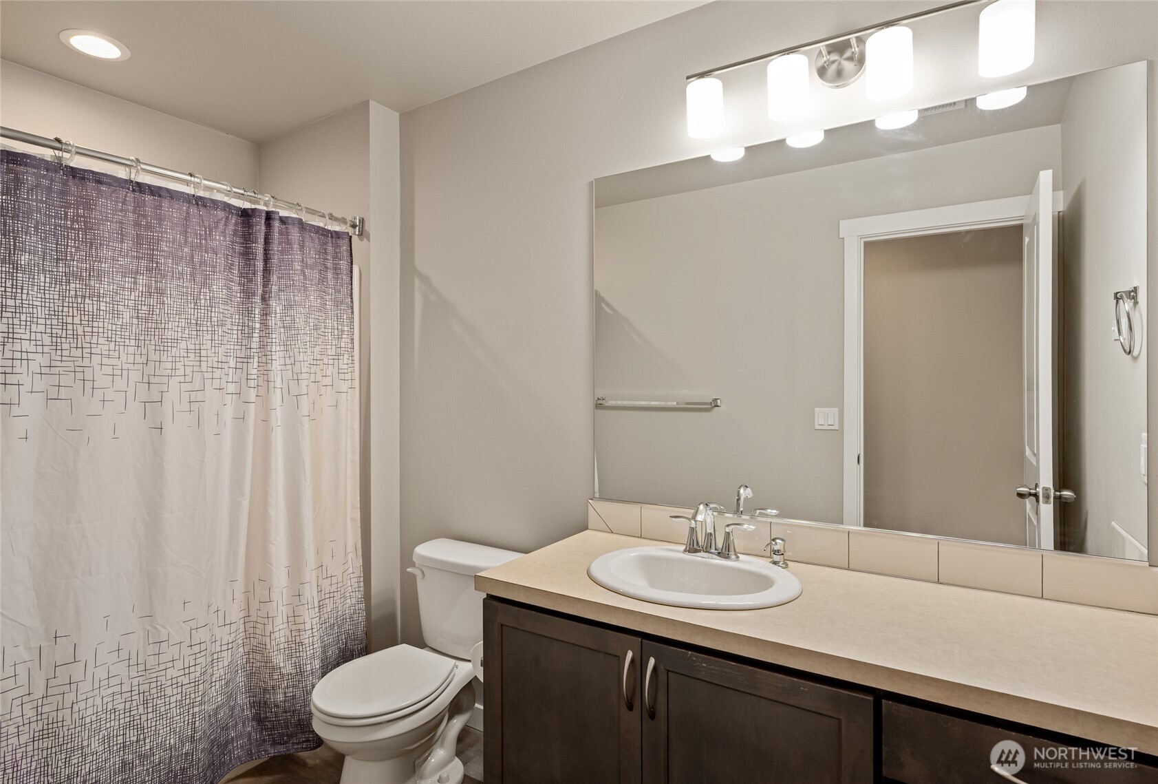711 10th Street Sultan, WA 98294 - Photo 23 of 30 a bathroom with a sink toilet and shower