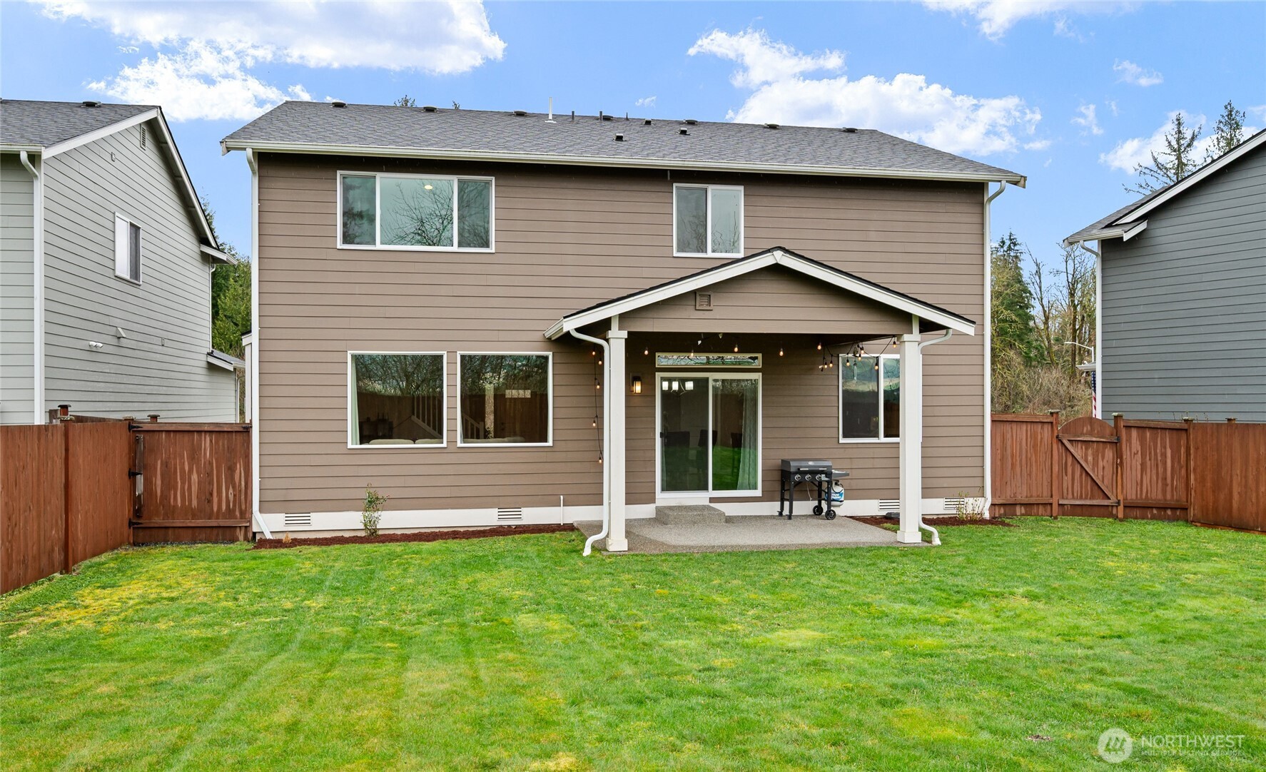 711 10th Street Sultan, WA 98294 - Photo 29 of 30 a front view of a house with a yard