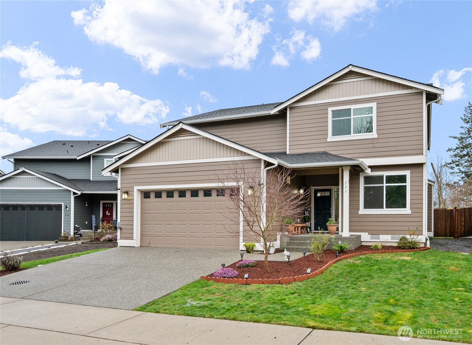 711 10th Street Sultan, WA 98294 - Photo 30 of 30 a front view of a house with garden