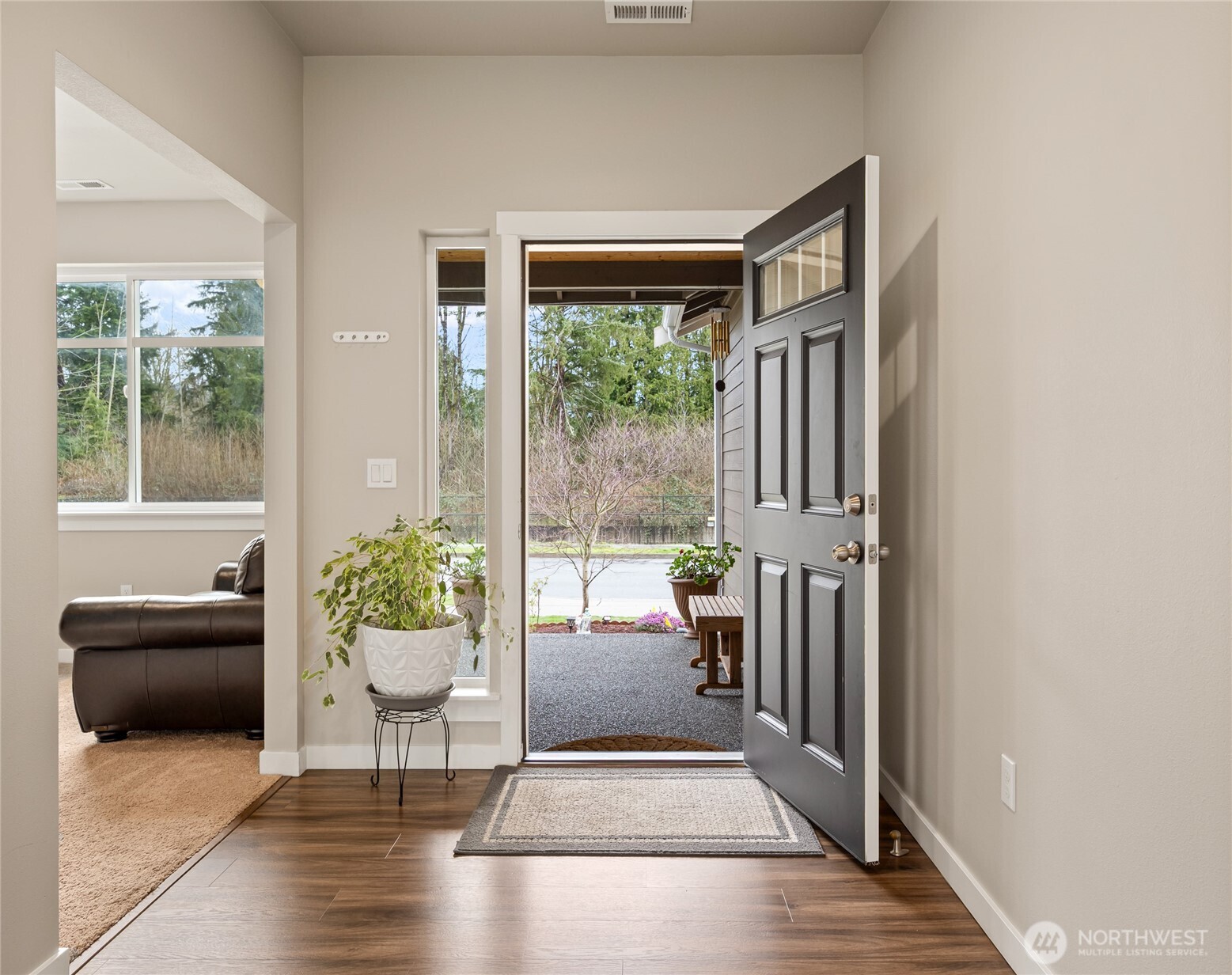 711 10th Street Sultan, WA 98294 - Photo 4 of 30 a living room with furniture and a potted plant