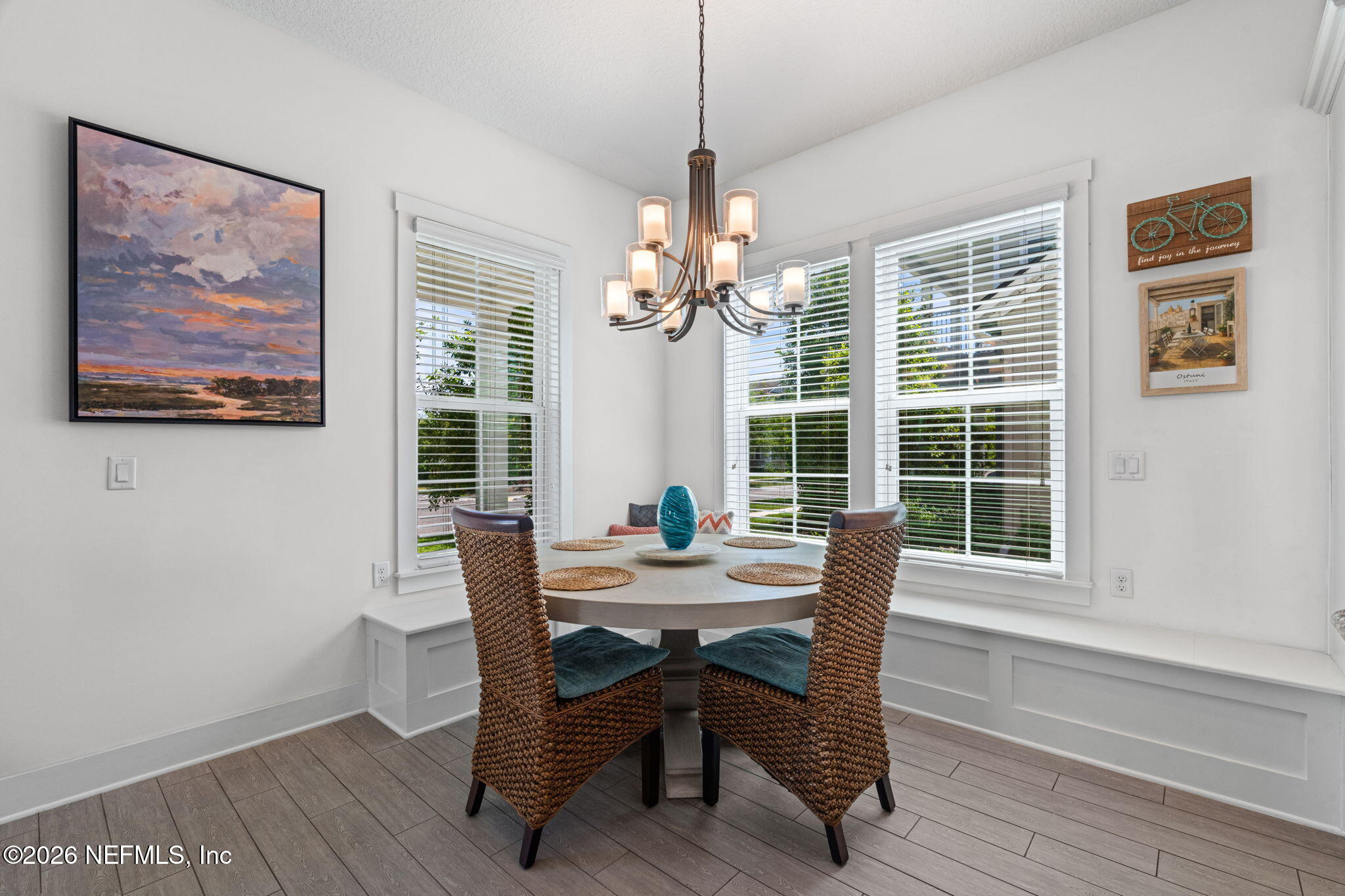 44 Fremont Avenue St. Augustine, FL 32095 - Photo 14 of 72 a dining room with furniture a chandelier and wooden floor